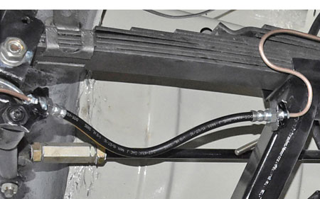 Picture: Mounted brake hose front axle for example at one of our customers restoring cars.<br>The picture only dispaly the mounting position. All other parts except the Front brake hose itself are not part of this offer!
